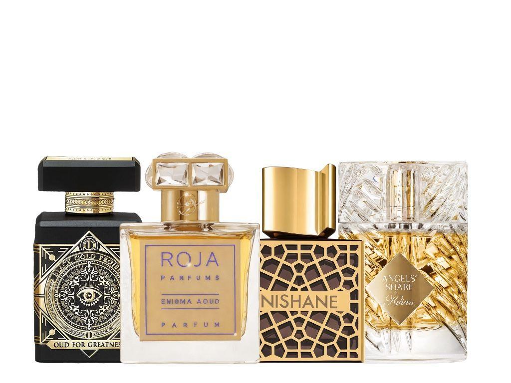 מארז דוגמיות בשמים יוקרתי הכולל את Angel Share by Kilian, Enigma Aoud של Roja, Oud For Greatness Initio ו-Nishane Ani – זמין באתר Profumez